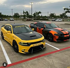 two orange and black sports cars parked in a parking lot next to eachother