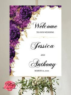 wedding welcome sign with purple flowers and greenery