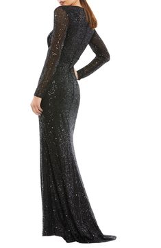 Embellished with sparkly sequins from head to toe with a tantalizing peek of skin at the neck and thigh, this long-sleeve gown channels old Hollywood glamour. 63" length (size 8) Deep V-neck Long sleeves Lined, except sleeves 100% polyester Spot clean Imported Asian Owned/Founded Fitted Gown With Contrast Sequin, Long Sleeve Sequin Evening Dress For Gala, Fitted Evening Gown With Contrast Sequin, Glamorous Long Sleeve Holiday Gown, Glamorous Long Sleeve Gown For Holidays, Fitted Long Sleeve Embellished Gown, Fall Wedding Embellished Evening Dress, Long Sleeve Embellished Gown For Night Out, Long Sleeve Sequin Dress For Formal Evening Events