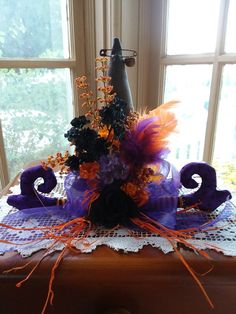 a table topped with purple and orange decorations