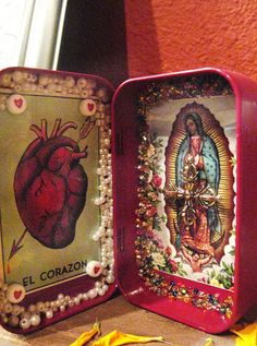 two tins with pictures and beads on them