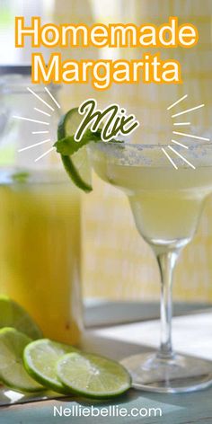 homemade margarita mix in a glass with limes