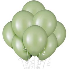 a bunch of green balloons are in the air