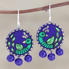 A colorful green bird sits at the center of these merry dangle earrings designed by Indian artisan Ritu Thapar. Crafted from oven-fired terracotta, the earrings are hand painted in green and blue, varnished, and finished with gleaming sterling silver hooks. Blue baubles hang from the bottom of the earrings for an extra dash of fun. Ad Earrings, Blue Baubles, India Gift, Green Bird, Gift Suggestions, Ceramic Birds, Women Artisans, Birds Painting, Hand Painted Ceramics