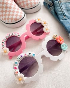 Brand new to the Louis and Finn shop, accessories for your little girl! How stinking cute are these custom flower sunglasses for your litte babe. These make perfect gifts and are especially great for sunny summer days, beach vacations, Easter baskets, birthday party favors, events, photoshoots and MORE! These sunglasses can be completely customized by YOU! Step 1: pick your fav sunglass color Step 2: tell us which design is your favorite! - Flower Child: your sunnies will come full of flowers th Custom Name Sunglasses For Summer Beach, Custom Name Sunglasses For Beach In Summer, Cute Customizable Plastic Sunglasses, Custom Name Pink Sunglasses With Adjustable Fit, Pink Sunglasses With Custom Name And Adjustable Fit, Playful Flower-shaped Plastic Sunglasses, Customizable White Adjustable Sunglasses, Cute White Plastic Sunglasses, Trendy White Sunglasses With Custom Name