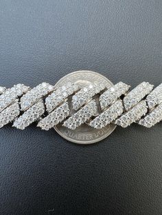 Men's 14mm wide Cuban Link prong set Chain set with moissanite
One of the iciest chains we ever made!!! Fully iced can't even see the metal!
 
Heavy 140-252 grams depending on length!
24" is 201 grams!!! VERY HEAVY CHAIN
 
REAL MOISSANITE
Comes with GRA Certificate
PASSES DIAMOND TESTER!!! ANY PEN OR LIGHT TRANSMISSION DIAMOND TESTER (Will show up as moissanite and not diamond on lab assays however)
32.5-54.6ct (depending on length...for instance 20" is 44.17ct) genuine D Ice Necklace, Cuban Link Necklace, American Diamond Necklaces, Miami Cuban Link Chain, Diamond Tester, Diamond Ice, Miami Cuban Link, Cuban Link Chain Necklaces, Heavy Chain