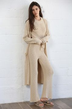 The Delia Pants in Natural are the perfect blend of comfort and elegance. Crafted with a knit sweater material, these pants offer a cozy and luxurious feel. The tie waist design ensures a flattering and adjustable fit, making these pants a must-have in any sophisticated wardrobe. Knit Lounge Set, Crochet Pants, Mock Neck Tank, Maxi Cardigan, Colored Cardigans, Duster Cardigan, Sweater Material, Spring Wardrobe, Sweater Pants