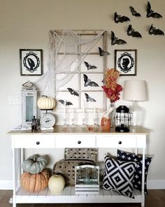 a white table topped with lots of halloween decorations