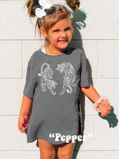 Dress your Little One trendy with this cute Kids Vintage Tigers Shirt! Comfort Colors® Tshirts are super soft and comfy! Size up for a Trendy Oversized look! ♥ Hello and Welcome to Meaningful Tees Shop! ♥ All of our items are made one at a time with care for each customer : ) ♥ Please allow 3-7 BUSINESS days (usually 3-5) for your item to be created PLUS shipping time via USPS ♥ Printed on the highest quality Youth Tshirt, the Comfort Colors 9018 is 100% Heavyweight Garment Dyed Cotton. Super so Family Matching Gray Short Sleeve Tops, Gray Family Matching Short Sleeve Tops, Family Matching Gray Short Sleeve T-shirt, Gray Family Matching Short Sleeve T-shirt, Gray Short Sleeve Family Matching T-shirt, Playful Relaxed Fit Soft-washed Tops, Playful Gray Top With Graphic Print, Playful Gray Graphic Print Top, Playful Crew Neck T-shirt Soft-washed