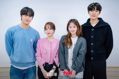 three young people standing next to each other in front of a white wall with the words king written on it