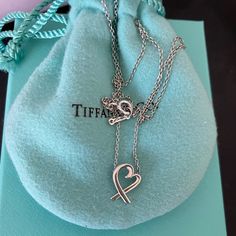 Tiffany & Co Loving Heart Pendant Necklace. Mini Size. 16” Chain, Sterling Silver, Paloma Picasso. Gently Used Condition. Will Look Brand New With Gentle Cleaning. Comes With Dustbag, Box, Bag And Ribbon. Luxury Sterling Silver Open Heart Necklace, Luxury Sterling Silver Heart Necklace For Formal Occasions, Luxury Sterling Silver Heart Pendant Necklace, Luxury Silver Open Heart Necklace, Luxury Heart Shaped Sterling Silver Necklace, Luxury Heart-shaped Sterling Silver Necklace, Luxury Open Heart Necklace - Gift, Luxury Open Heart Necklace For Gift, Luxury Open Heart Necklace Gift