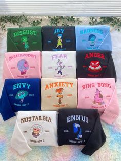 various t - shirts with the names of different cartoon characters and their name on them