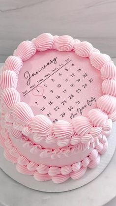 a pink cake with a calendar on it