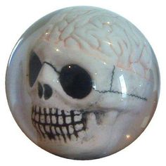 a glass ball with a skull painted on it