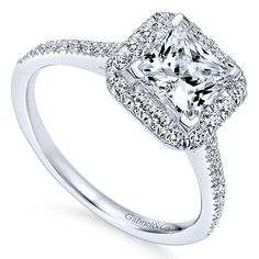 a princess cut diamond engagement ring with pave set shoulders