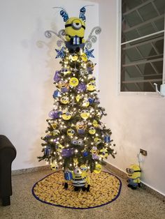 a decorated christmas tree with minion decorations