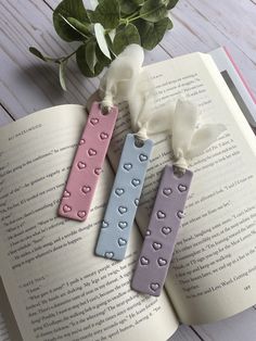 two bookmarks sitting on top of an open book