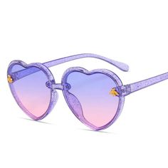 Heart Sunglasses in Purple Glitter *Listing is for ONE pair of sunglasses* - Fits approximate age range from 18 months - 10 years old Cheap Purple Party Sunglasses, Cute Pink Cartoon, Heart Kids, Pink Cartoon, Baby Sunglasses, Heart Shaped Frame, Heart Shaped Sunglasses, Heart Sunglasses, Girl With Sunglasses