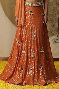 Rust orange textured lehenga with placement embroidery. Paired with a gathered blouse with matching texture and embroidery on neckline and a ruffled net dupatta. - Aza Fashions Sequins Lehenga, Lehenga And Blouse, Orange Lehenga, Placement Embroidery, Orange Texture, Lehenga Blouse, Net Dupatta, Rust Orange, Set Women