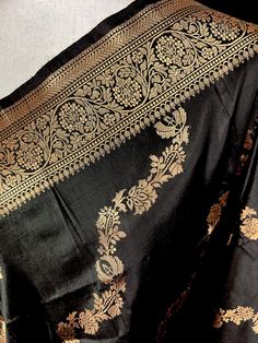 SILK MARK CERTIFIED !!!Black Color Pure Banarasi Katan Silk Dupatta with Muted Gold Zari. Item : DupattaBase Fabric : Pure Katan Silk Color : Black Silk Mark Certificate given with the Saree(Yes/No) : Yes Disclaimer -:- Color variation is possible due to various reasons like phone or desktop setting, resolution etc. Please don't hold us responsible. Our aim is to put the exact color of the Saree.- If the Saree is Pure Silk, we will put it very clearly in our listing that it is Pure Silk. If we d Luxury Silk Mark Certified Dupatta, Luxury Katan Silk Dupatta With Printed Border, Luxury Katan Silk Fabric With Pallu, Black Traditional Wear For Eid, Black Blouse Piece With Dupatta For Puja, Black Katan Silk Blouse Piece With Traditional Patterns, Black Katan Silk Dupatta With Motifs, Black Banarasi Silk Dupatta With Motifs, Black Dupatta For Puja And Transitional Season