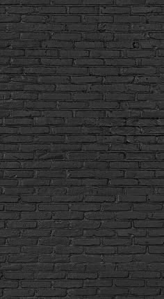 a black brick wall that is very dark