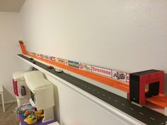 there is a toy train set on the wall