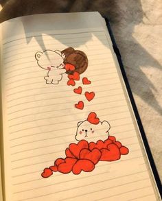 an open notebook with drawings of bears and hearts on the pages, one bear is falling asleep