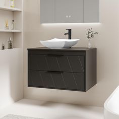 a bathroom with a sink, mirror and shelving unit in the wall above it