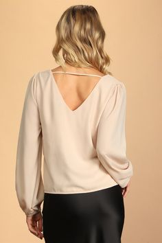 The Lulus Stylish and Sincere Beige Long Sleeve V-Neck Top is always serious when it comes to staying chic! Lightweight woven fabric shapes a V-neckline and back (with a strappy detail), plus a wide-cut boxy bodice. Long sleeves have gathering at the shoulders and elastic cuffs. Fit: This garment fits true to size. Length: Size medium measures 23.25" from shoulder to hem. Bust: Great for any cup size. Waist: Not Fitted - comfortable room throughout midsection. Undergarments: May be worn with any Beige Long Sleeve, Beige Top, Comfortable Room, Cup Size, V Neck Tops, Women's Tops, Long Sleeve Top, Woven Fabric, Bodice