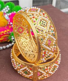 Beautiful Indian Jadau kada set. Gold plated kada/bangles in multicolour available in size 2.8 however as these are openable bangles they would also fit a size 2.10. Absolutely stunning. Available in 2 designs. These come as a pair This eye catching unique ethnic jewellery is ideal for any traditional attire This piece is readily available for immediate dispatch. Please note as this is a handmade piece there may be slight colour and texture variation due to lighting effects. We do not offer a re Jadau Kada, Pakistani Bangles, Jadau Bangles, Jadau Necklace, Kundan Bangles, American Diamond Jewellery