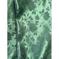 a close up view of a green floral print fabric