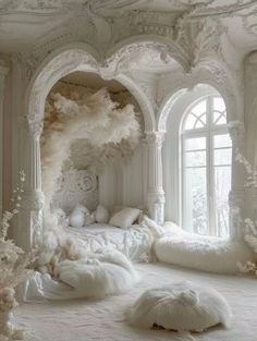 an elaborate bedroom with white fur and pillows