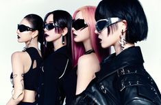 three women with pink hair and black sunglasses are standing in front of a white wall