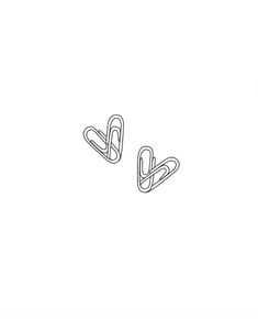 the outline of two paper clips on a white background