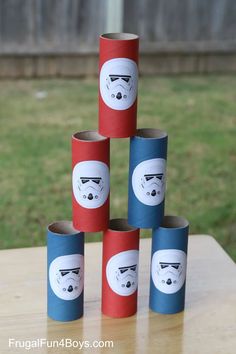 several rolls of toilet paper are stacked up in the shape of stormtroopers