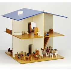 a doll house with furniture and accessories on the floor in front of a white background