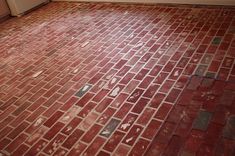 a kitchen floor that has been cleaned and stained red