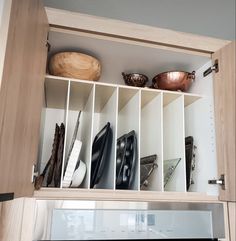 an oven built into the wall with pots and pans on it