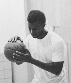 a man holding a basketball in his right hand