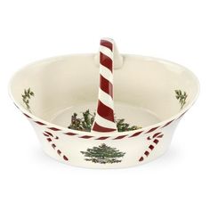 a bowl with a candy cane in it