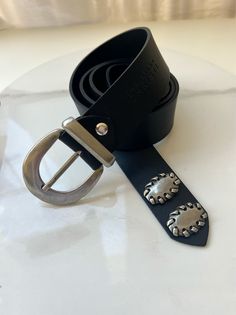 Introducing our meticulously handcrafted Black Leather Belt for Women on Etsy! Made with genuine, high-quality leather, this belt features a stunning silver buckle at the center and a stylish metal loop with a bohemian touch. Adding to its uniqueness, a minimal silver arrow adorns the belt's edge. With a range of 8 different length options, finding the perfect fit is effortless. Elevate your style with this exceptional belt that combines quality craftsmanship and timeless design. Shop now and ad Mens Cross Bracelet, Leather Belt Women, Mens Bracelet Black, Handmade Belt, Evil Eye Necklace Gold, Black Gladiator Sandals, Women Belt, Handmade Belts, Belt Women