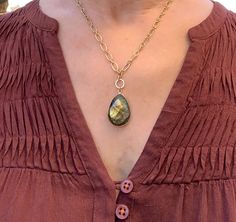 "Beautiful Sparkling Labradorite and Matte Gold Necklace 18\" adjustable matte gold chain with  The pendant drop is approximately 1.5\" and consists of a faceted pear shaped Labradorite stone 1\" long x 3/4\"wide, hanging from a 1/4\" d    (10mm) gold plated ring The labradorite stone has a lovely iridescent quality with gold, blue and green hues when light hits it. This handmade piece is one of a kind- no two are exactly alike. *The lobster clasp fits through links in chain and can be adjusted Gold Teardrop Drop Necklace With Natural Stones, Gold Labradorite Oval Pendant Necklace, Gold Teardrop Labradorite Necklace, Luxury Adjustable Labradorite Necklaces, Gold Labradorite Teardrop Pendant Jewelry, Faceted Labradorite Necklace For Gift, Gold Faceted Labradorite Necklace, Matte Gold Necklace, Pyrite Necklace