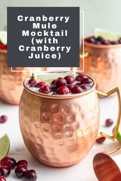 cranberry mule cocktail in copper mugs with lime and cranberries on the side