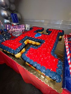 a large red, white and blue cake on top of a table