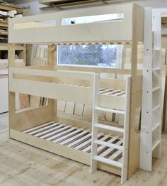 the bunk beds are all made up and ready to be put into the house or used as an office