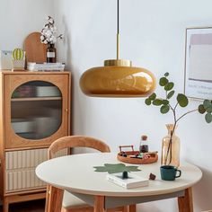 a dining room with a table and chairs