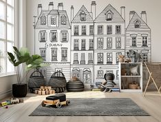 a child's room with black and white wallpaper that has houses drawn on it