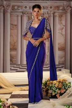 Purple pre-draped saree with sequins, beads embroidery in placement pattern. Paired with a padded blouse with elevated sleeves and floret motif, linear sequin embroidery. Comes along with embroidered belt. - Aza Fashions Golden Corset, Embroidery Sarees, Beaded Work, Purple Saree, Weddings Receptions, Crepe Saree, Gown Skirt, Padded Blouse, Embroidered Belt