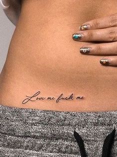 a woman's stomach with the words love and life written on her lower back