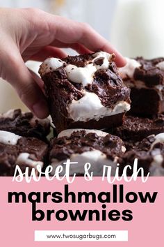 chocolate brownies with marshmallows and cream frosting on top are shown